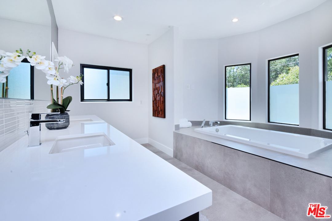 14520 Greenleaf Street Sherman Oaks, CA 91403 - Photo 52 of 54 a large white kitchen with a large window