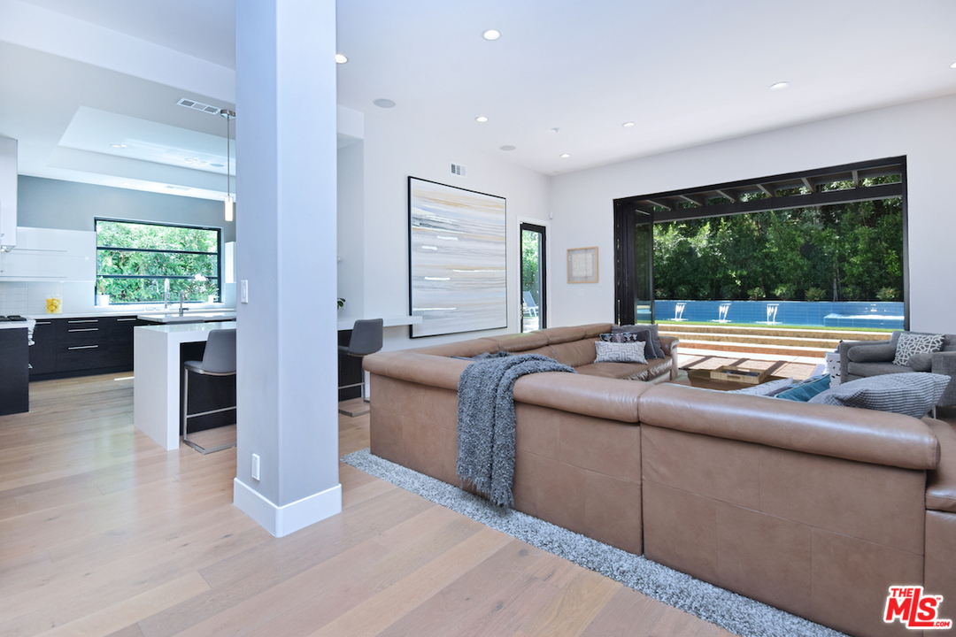 14520 Greenleaf Street Sherman Oaks, CA 91403 - Photo 8 of 54 a living room with couch and a large window