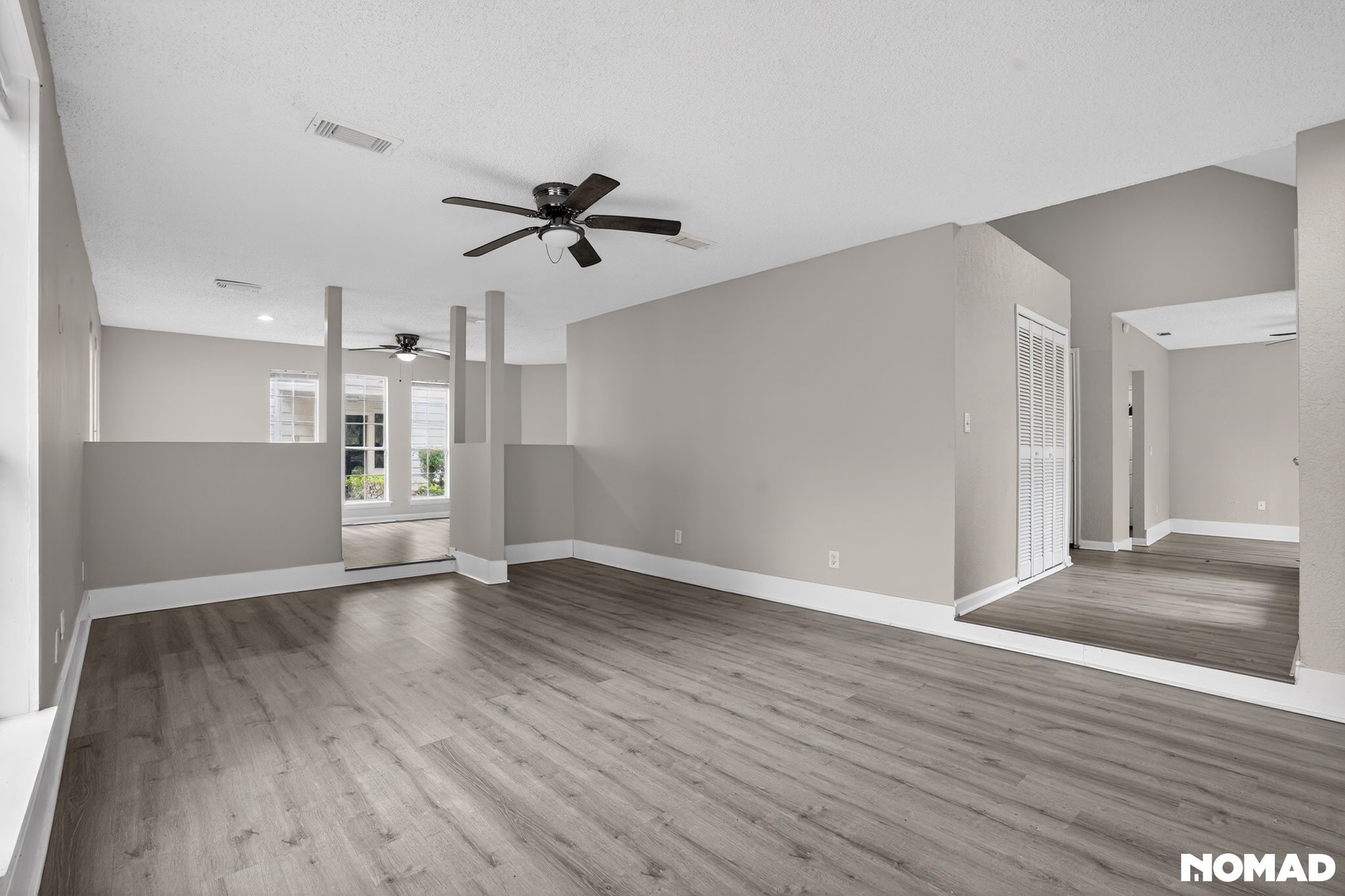17805 Villa Way Drive Spring, TX 77379 - Photo 12 of 38 a view of empty room with wooden floor and window