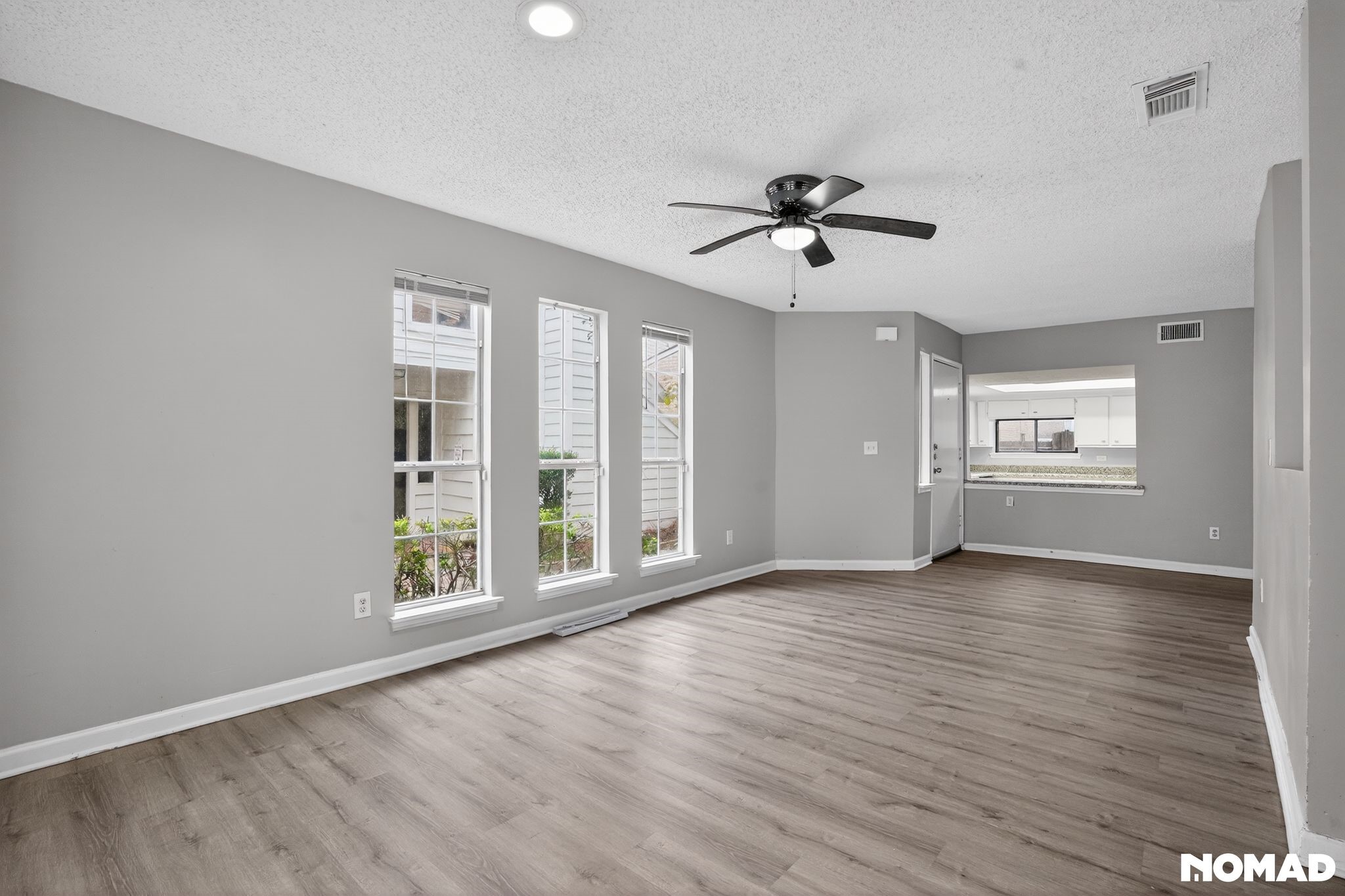 17805 Villa Way Drive Spring, TX 77379 - Photo 13 of 38 a view of an empty room with a window and wooden floor