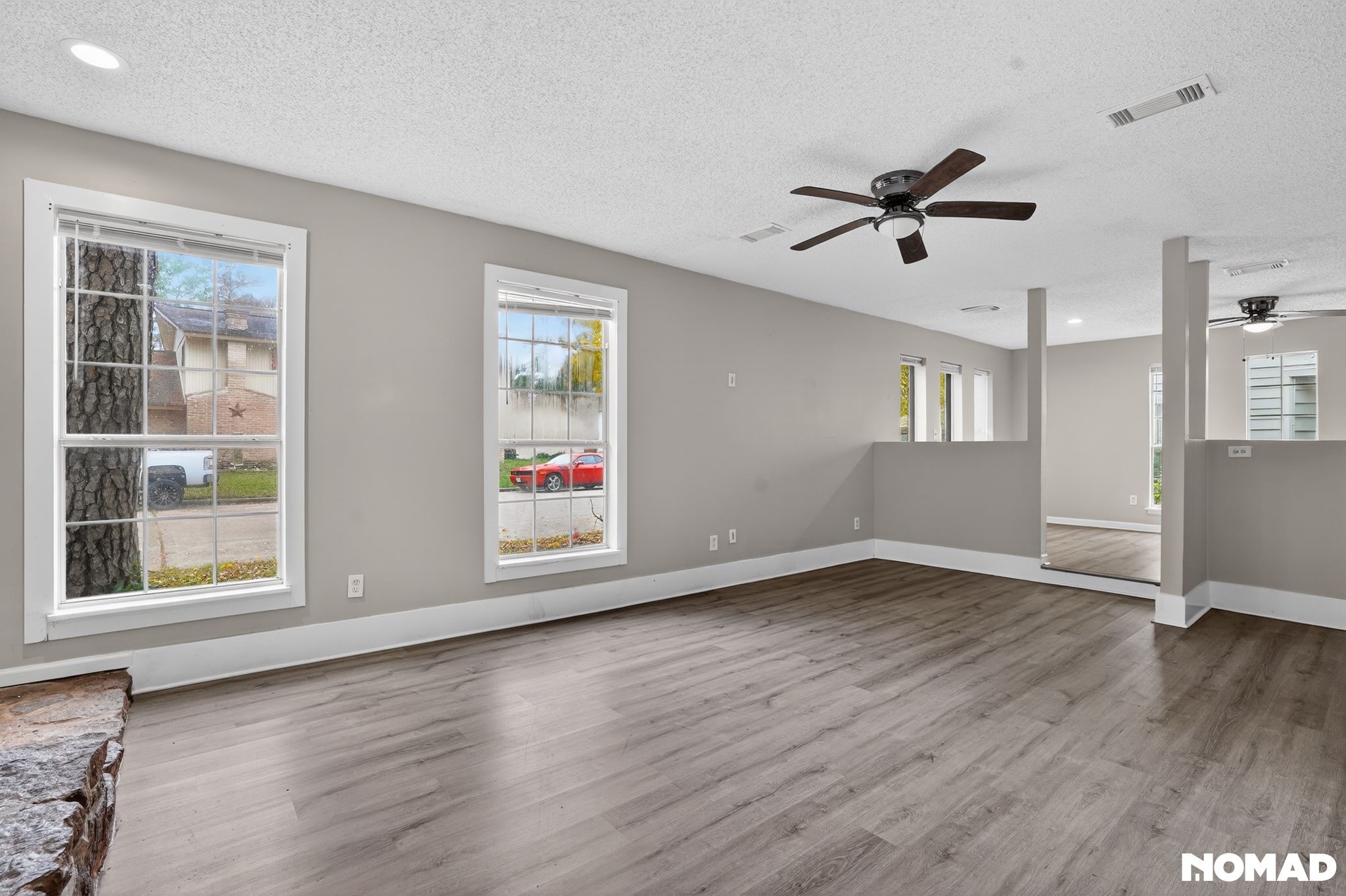 17805 Villa Way Drive Spring, TX 77379 - Photo 14 of 38 a view of an empty room with wooden floor and a window