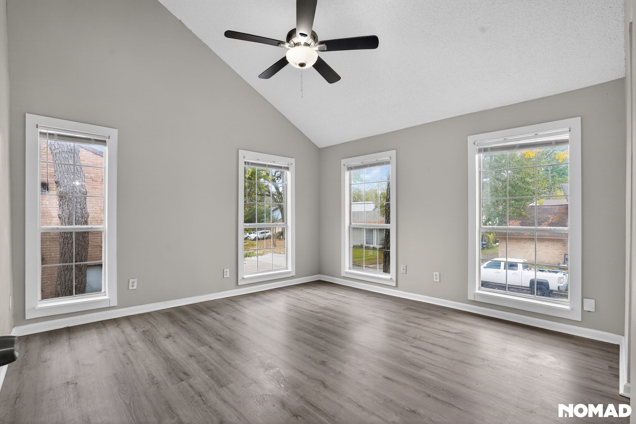 17805 Villa Way Drive Spring, TX 77379 - Photo 16 of 38 a view of an empty room with a window and wooden floor