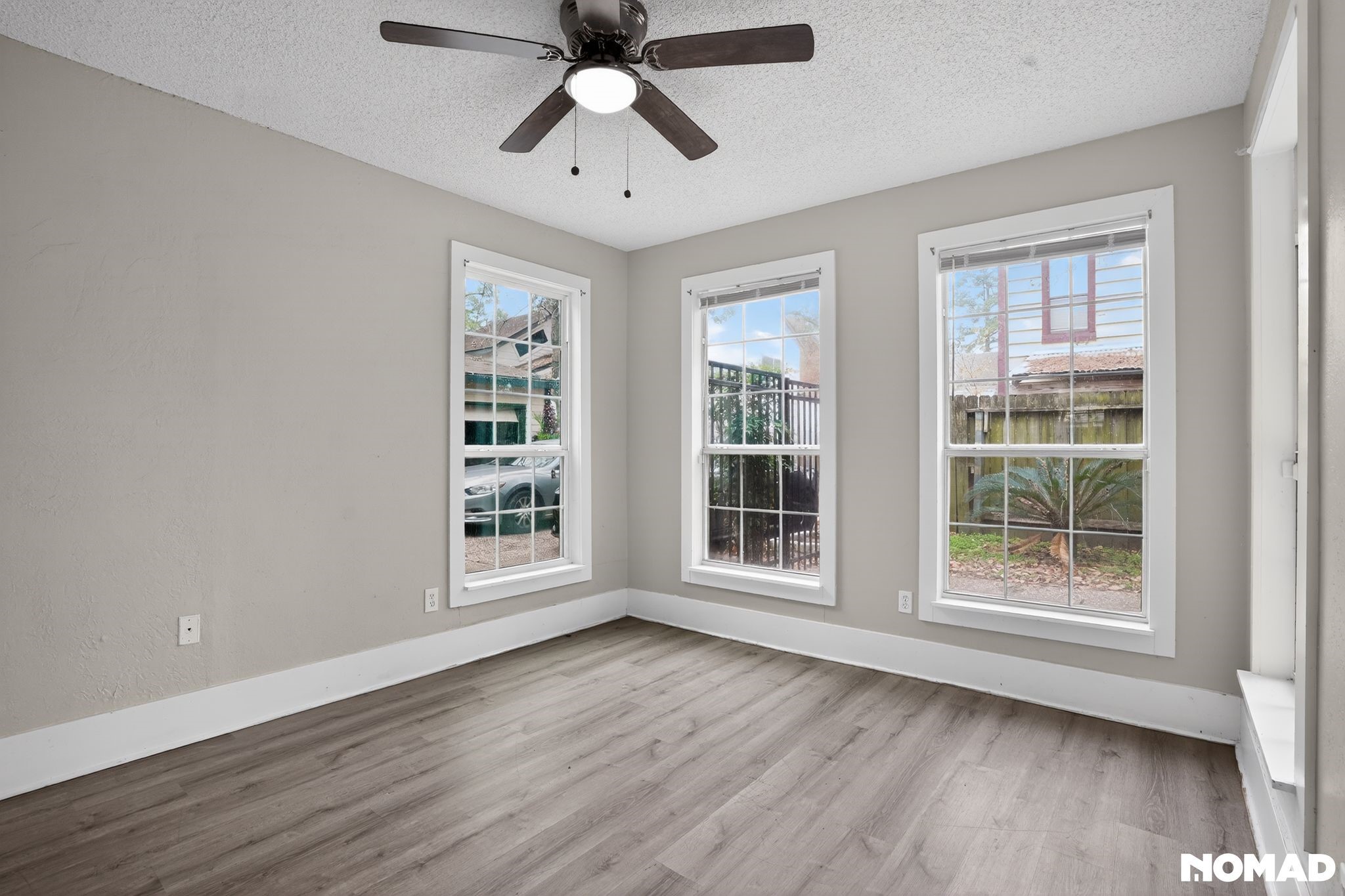 17805 Villa Way Drive Spring, TX 77379 - Photo 17 of 38 an empty room with wooden floor fan and windows