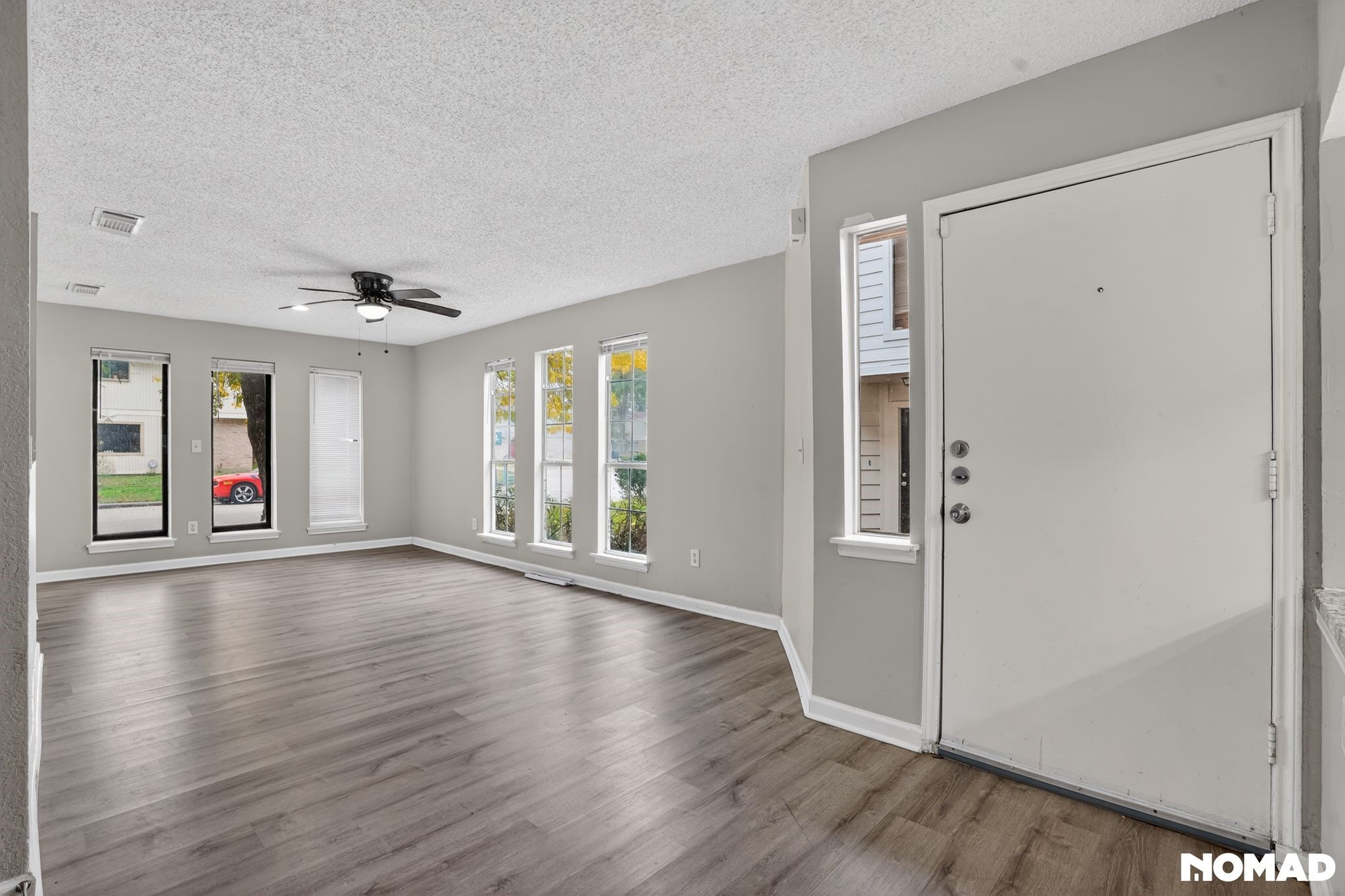 17805 Villa Way Drive Spring, TX 77379 - Photo 20 of 38 an empty room with wooden floor and windows