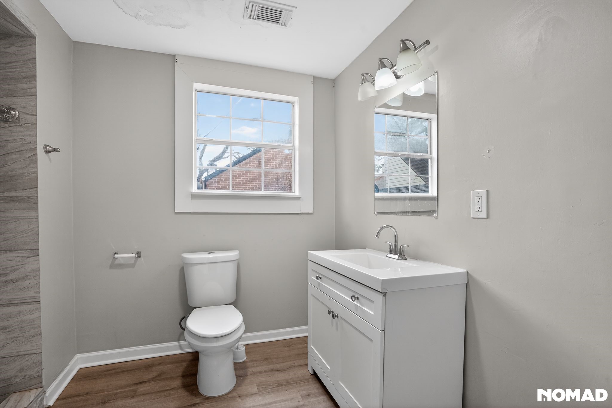 17805 Villa Way Drive Spring, TX 77379 - Photo 21 of 38 a bathroom with a toilet sink and mirror