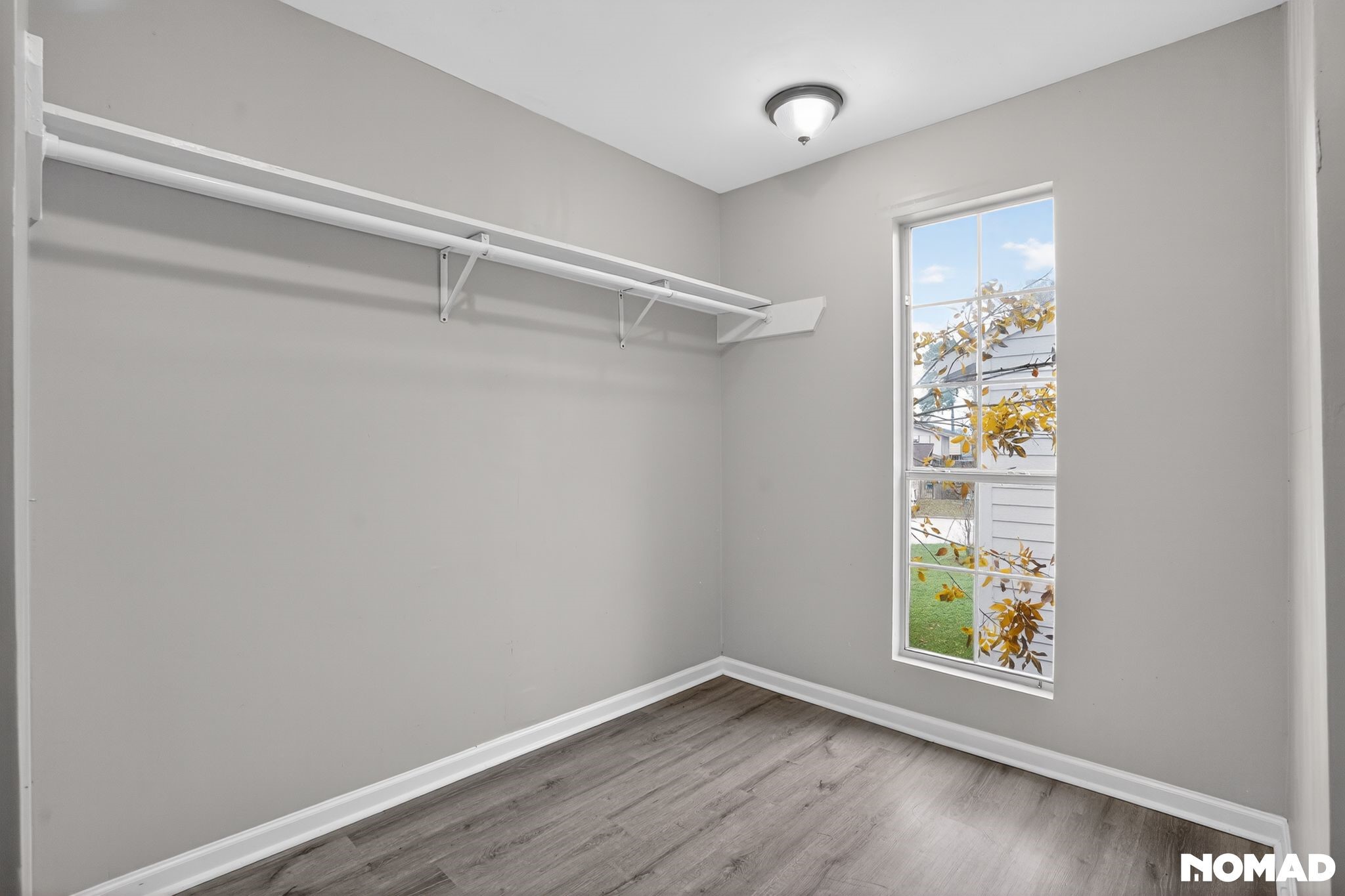 17805 Villa Way Drive Spring, TX 77379 - Photo 28 of 38 a view of an empty room with wooden floor and a window