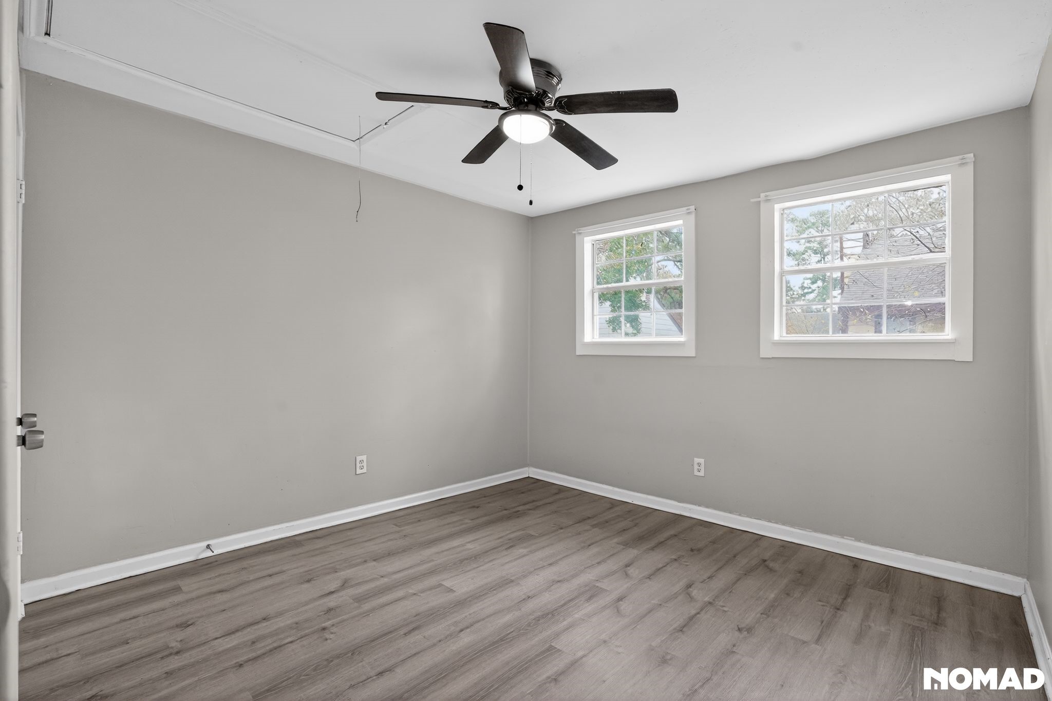 17805 Villa Way Drive Spring, TX 77379 - Photo 31 of 38 an empty room with wooden floor and windows