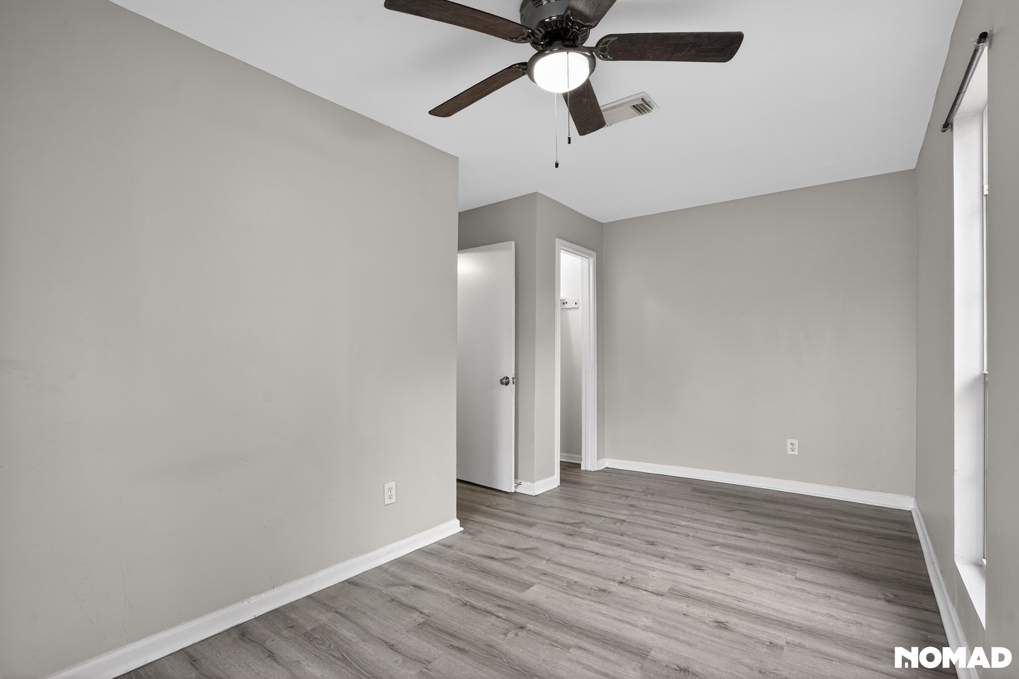 17805 Villa Way Drive Spring, TX 77379 - Photo 32 of 38 an empty room with wooden floor and ceiling fan