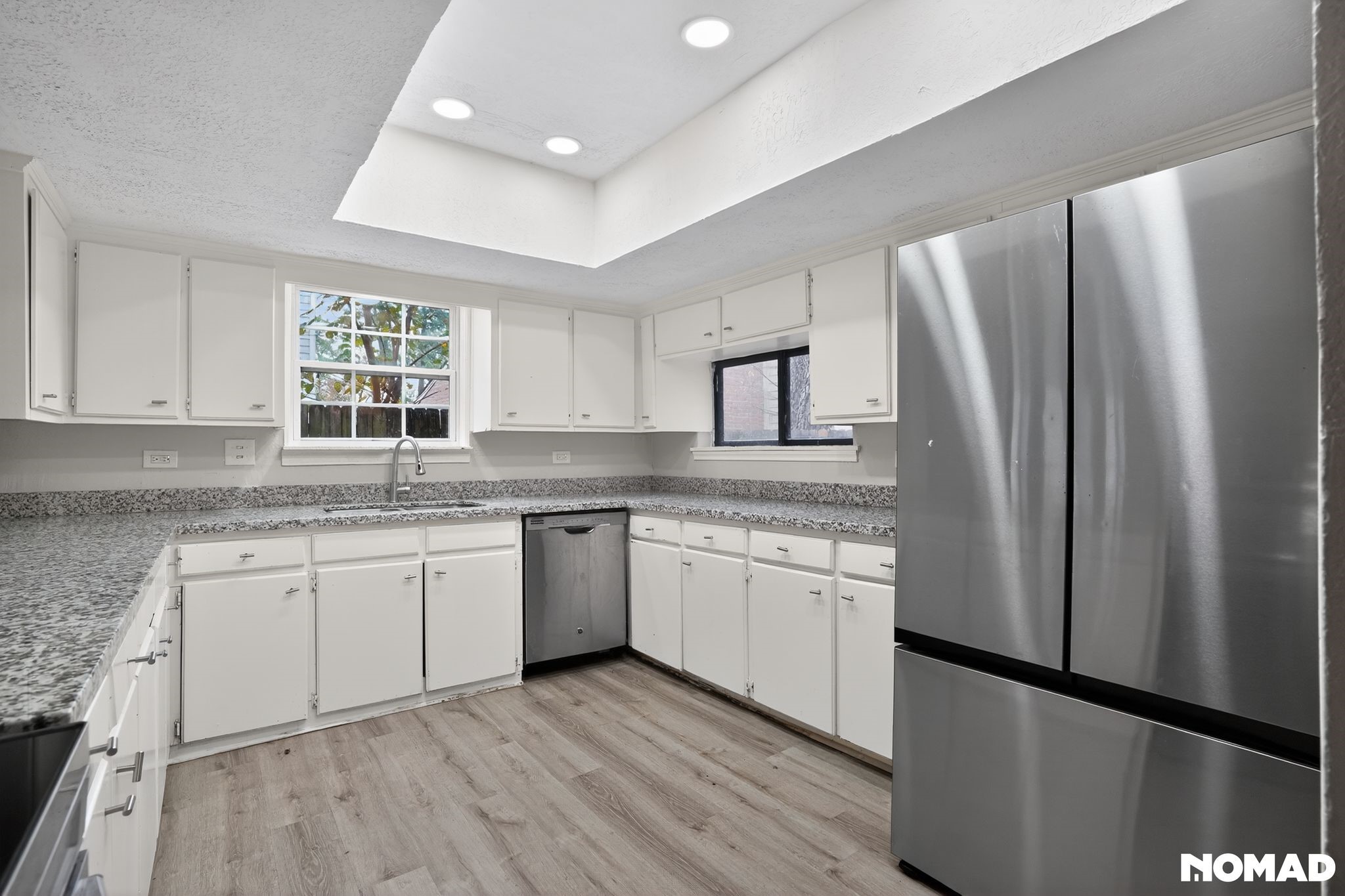 17805 Villa Way Drive Spring, TX 77379 - Photo 8 of 38 a kitchen with granite countertop stainless steel appliances a refrigerator sink and microwave