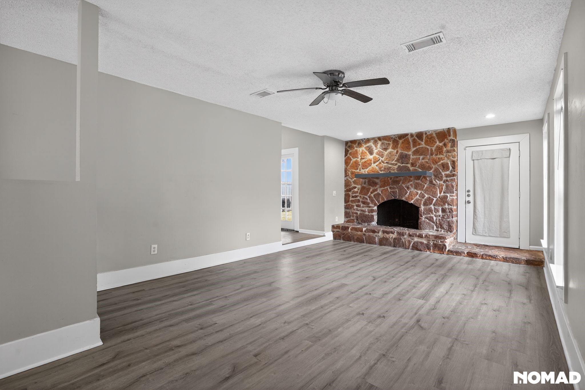 17805 Villa Way Drive Spring, TX 77379 - Photo 10 of 38 a view of empty room with wooden floor and fireplace