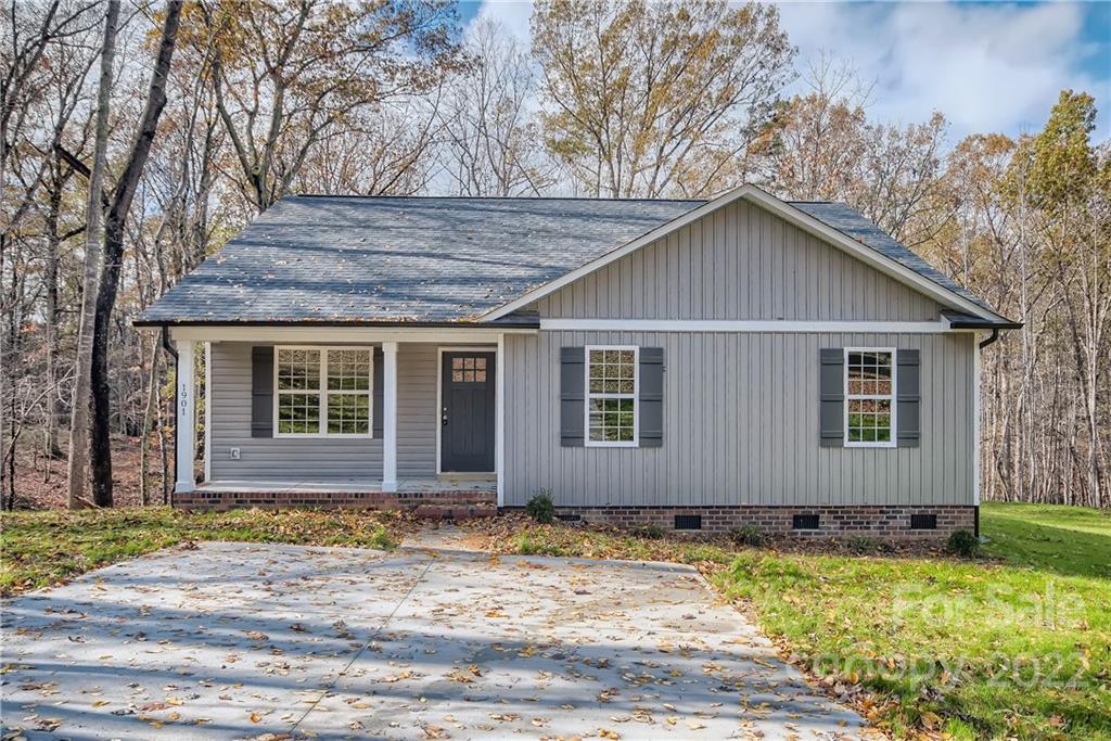 1901 Collins Drive Albemarle, NC 28001 - Photo 1 of 11 a front view of a house with a yard