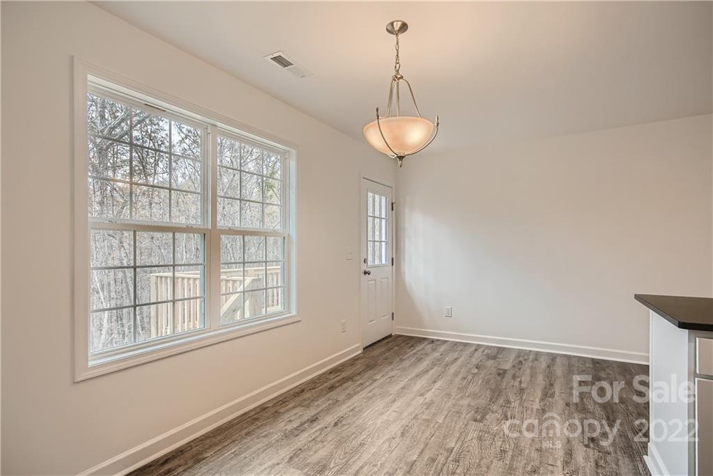 1901 Collins Drive Albemarle, NC 28001 - Photo 3 of 11 a view of empty room with wooden floor and window