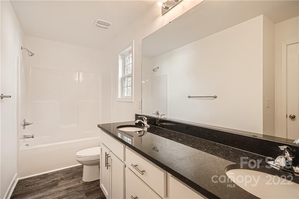 1901 Collins Drive Albemarle, NC 28001 - Photo 6 of 11 a bathroom with a sink and a mirror