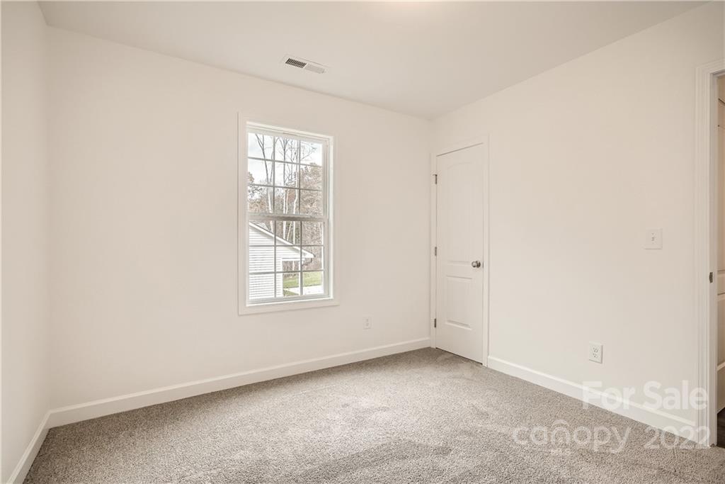 1901 Collins Drive Albemarle, NC 28001 - Photo 9 of 11 an empty room with a window