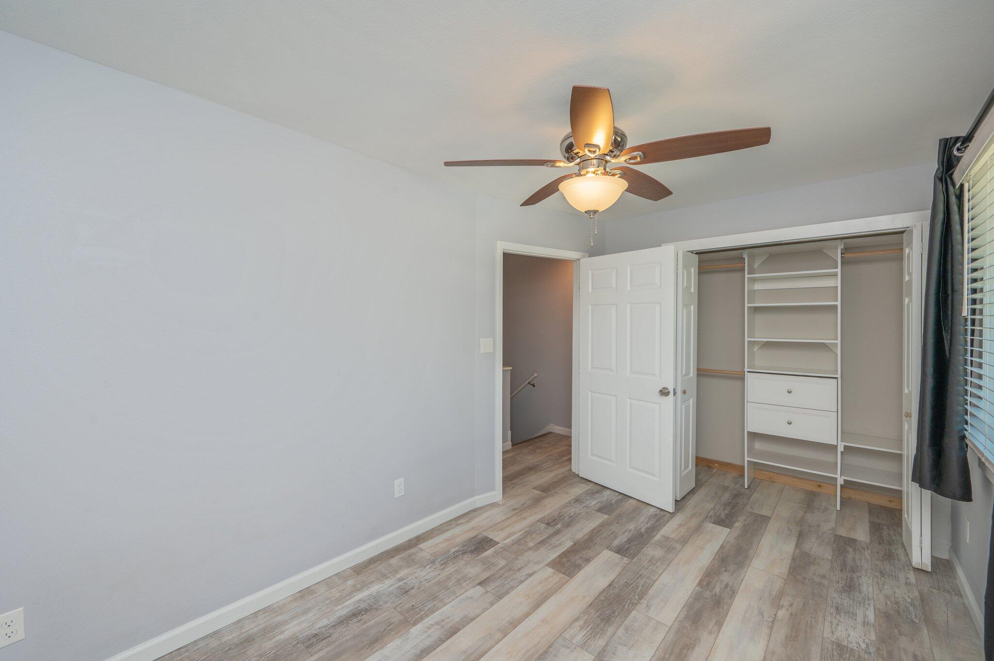 710 Legion Drive Destin, FL 32541 - Photo 19 of 29 a view of a room with closet and a ceiling fan