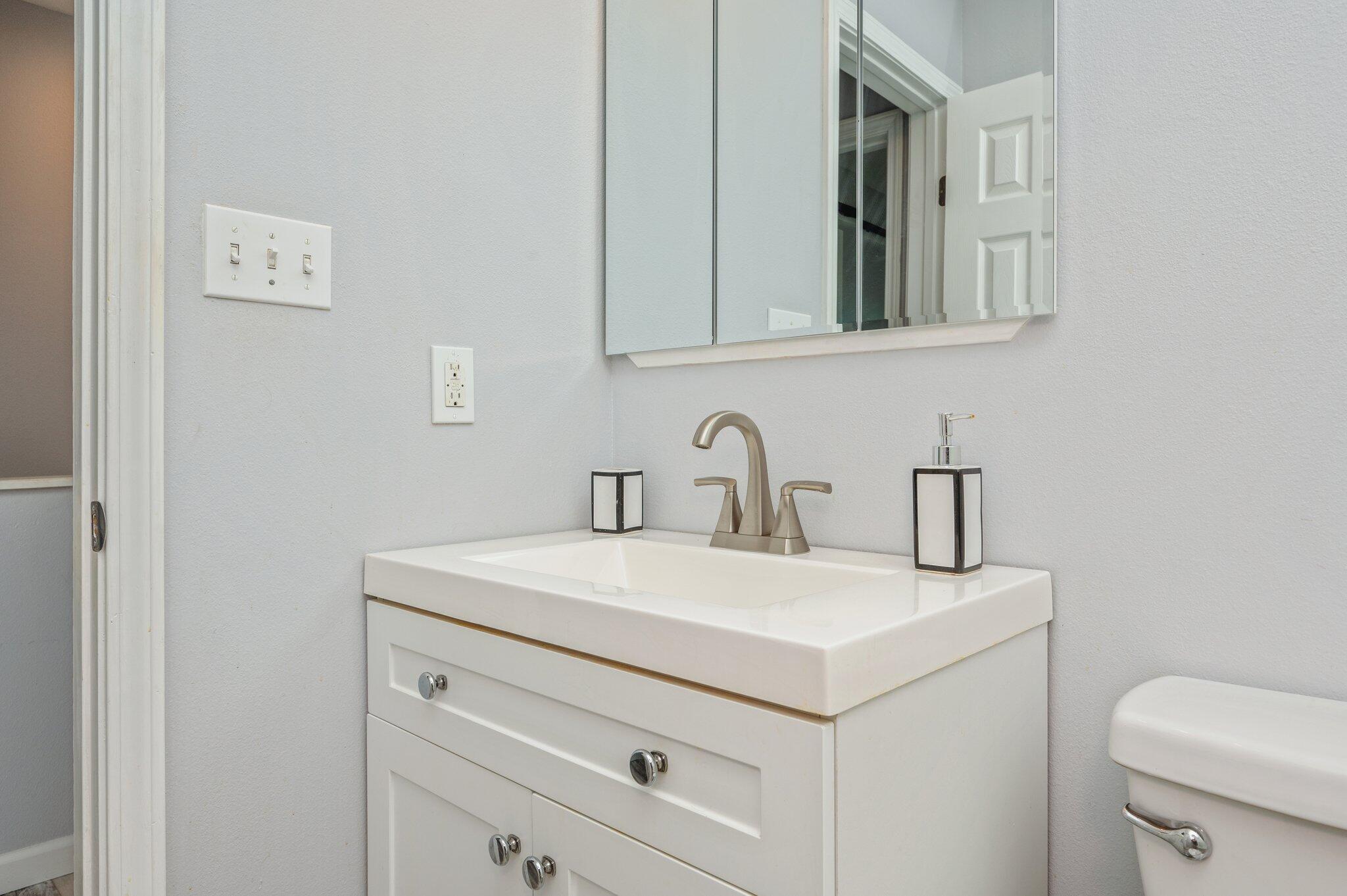 710 Legion Drive Destin, FL 32541 - Photo 24 of 29 a bathroom with a sink and a toilet