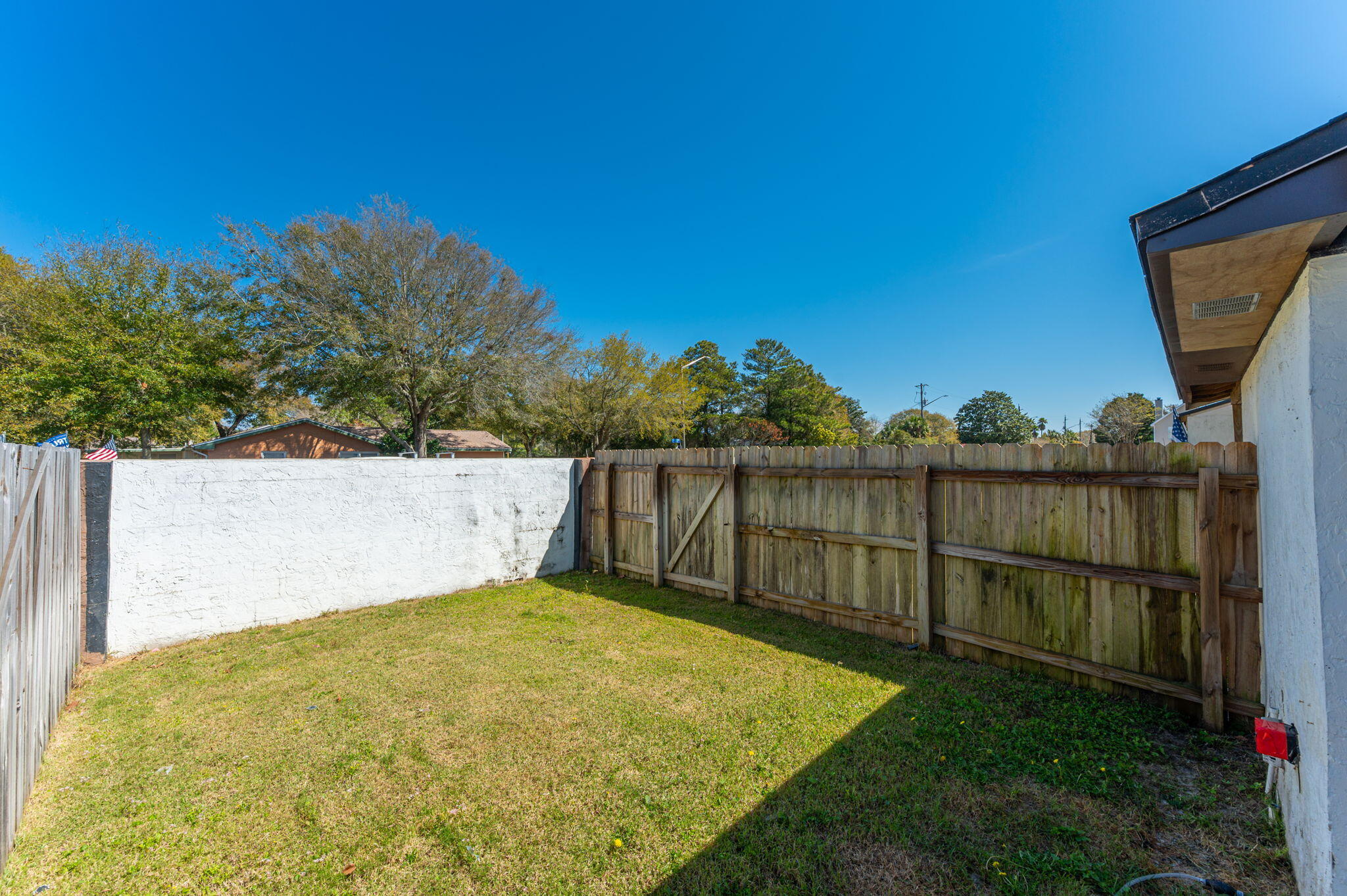 710 Legion Drive Destin, FL 32541 - Photo 29 of 29 a view of a backyard with wooden fence
