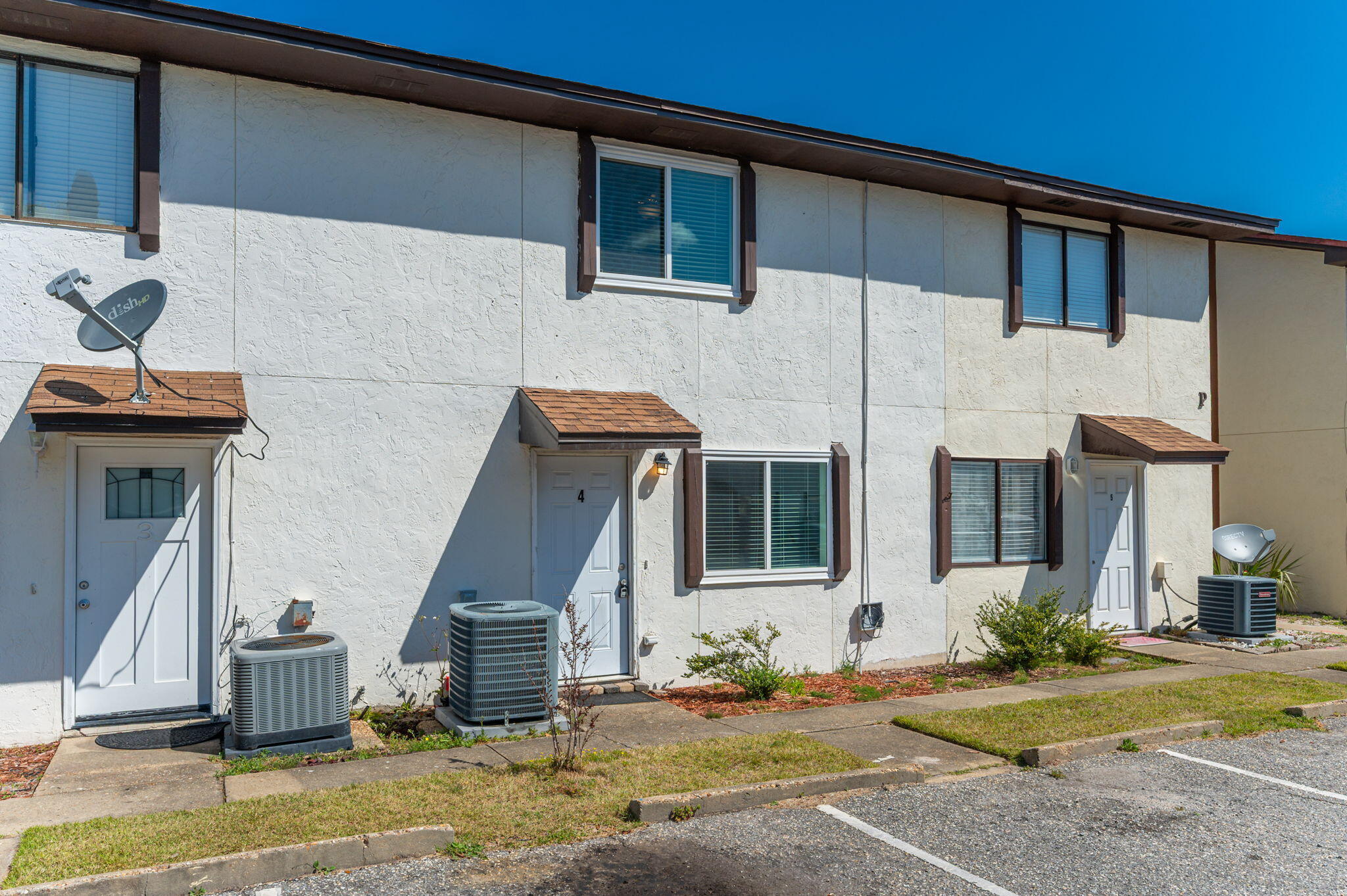 710 Legion Drive Destin, FL 32541 - Photo 3 of 29 a front view of a house with a yard
