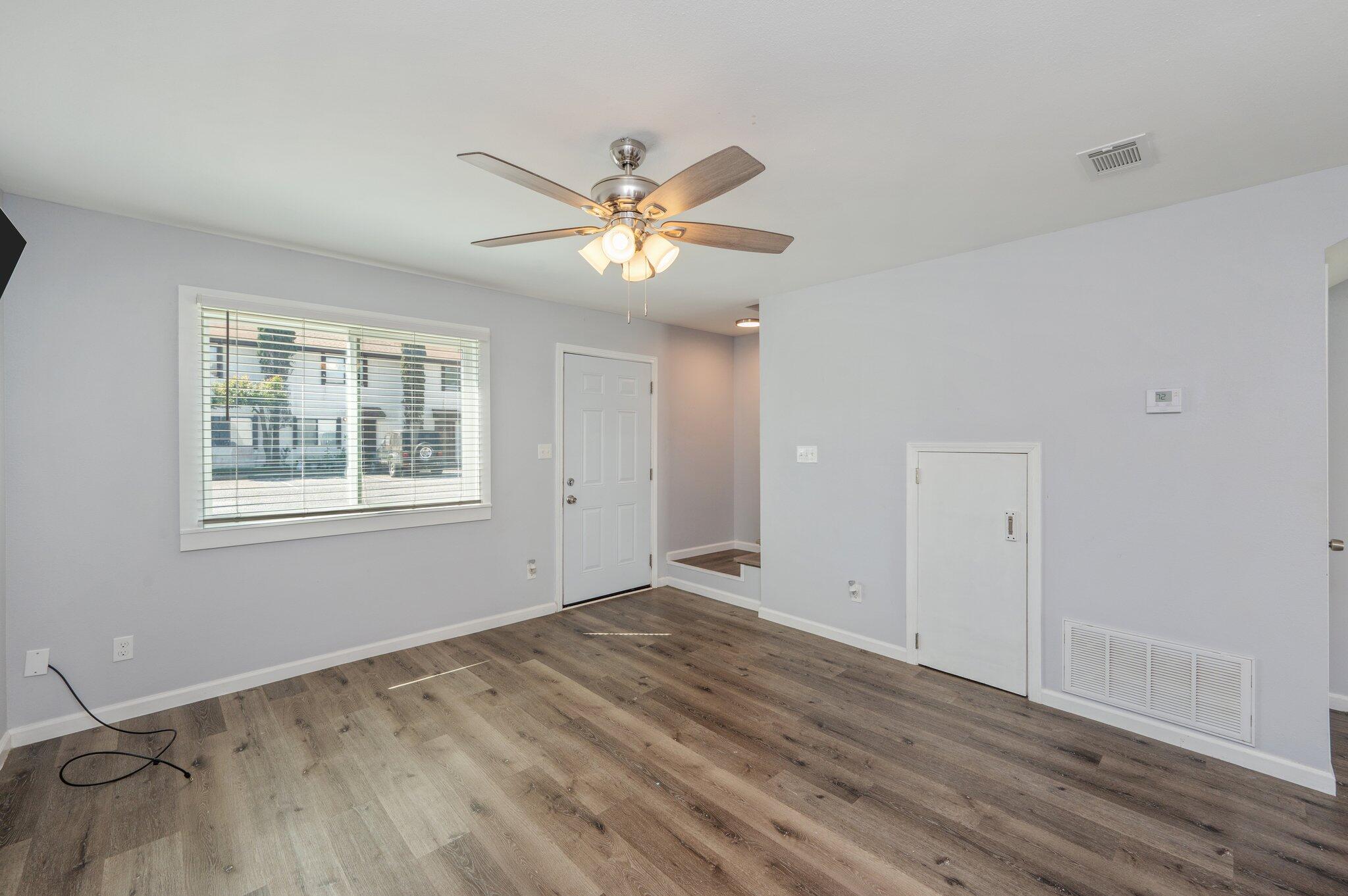 710 Legion Drive Destin, FL 32541 - Photo 8 of 29 a view of empty room with wooden floor and fan