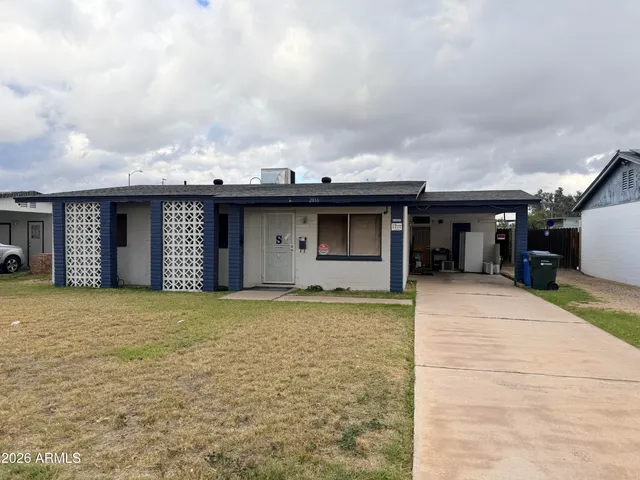 a view of a house with basketball court