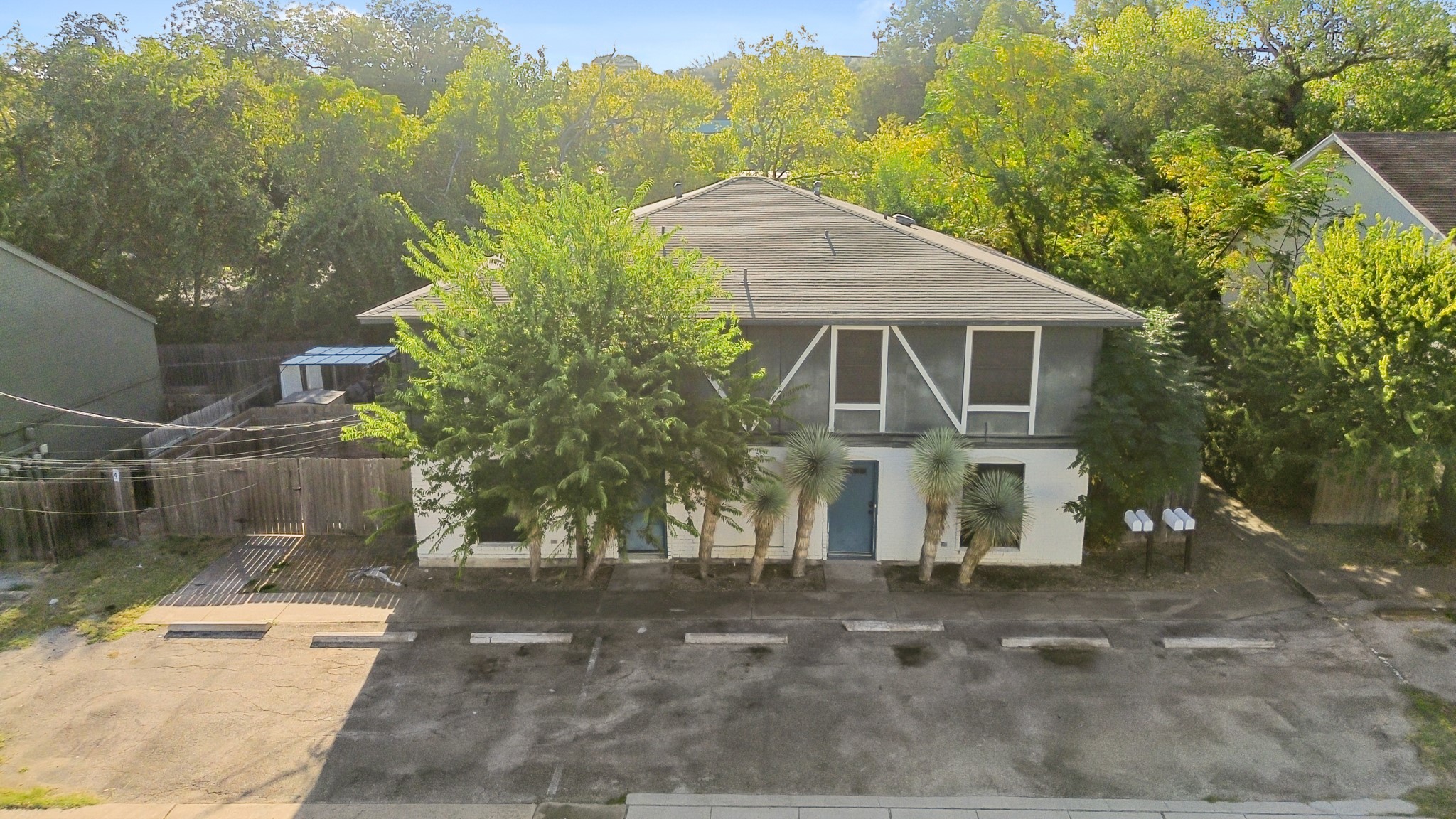 3507 Alpine Circle Austin, TX 78704 - Photo 29 of 30 a view of a white house next to a yard with large trees