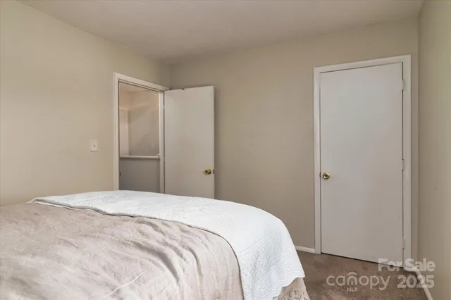a bedroom with a bed and a cabinets