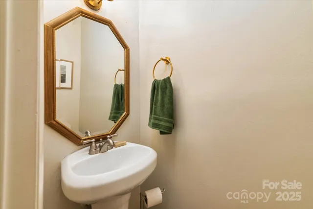 a bathroom with a sink and mirror