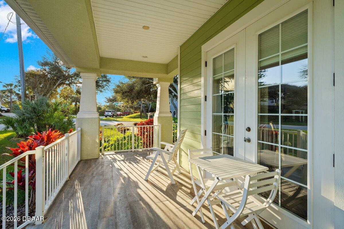 4767 Riverglen Boulevard Ponce Inlet, FL 32127 - Photo 17 of 60 a bedroom with a bed and a table