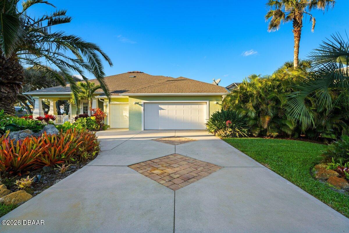4767 Riverglen Boulevard Ponce Inlet, FL 32127 - Photo 19 of 60 a view of a house with a yard