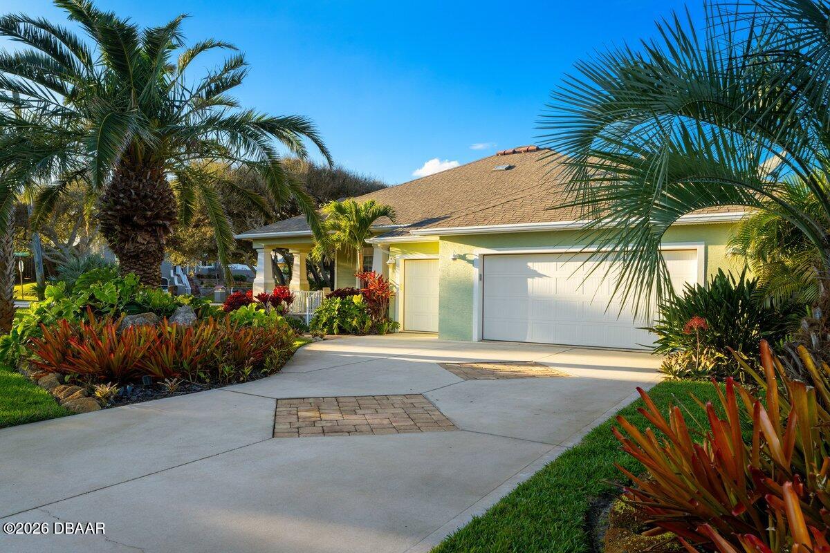 4767 Riverglen Boulevard Ponce Inlet, FL 32127 - Photo 20 of 60 a view of a yard and a plants