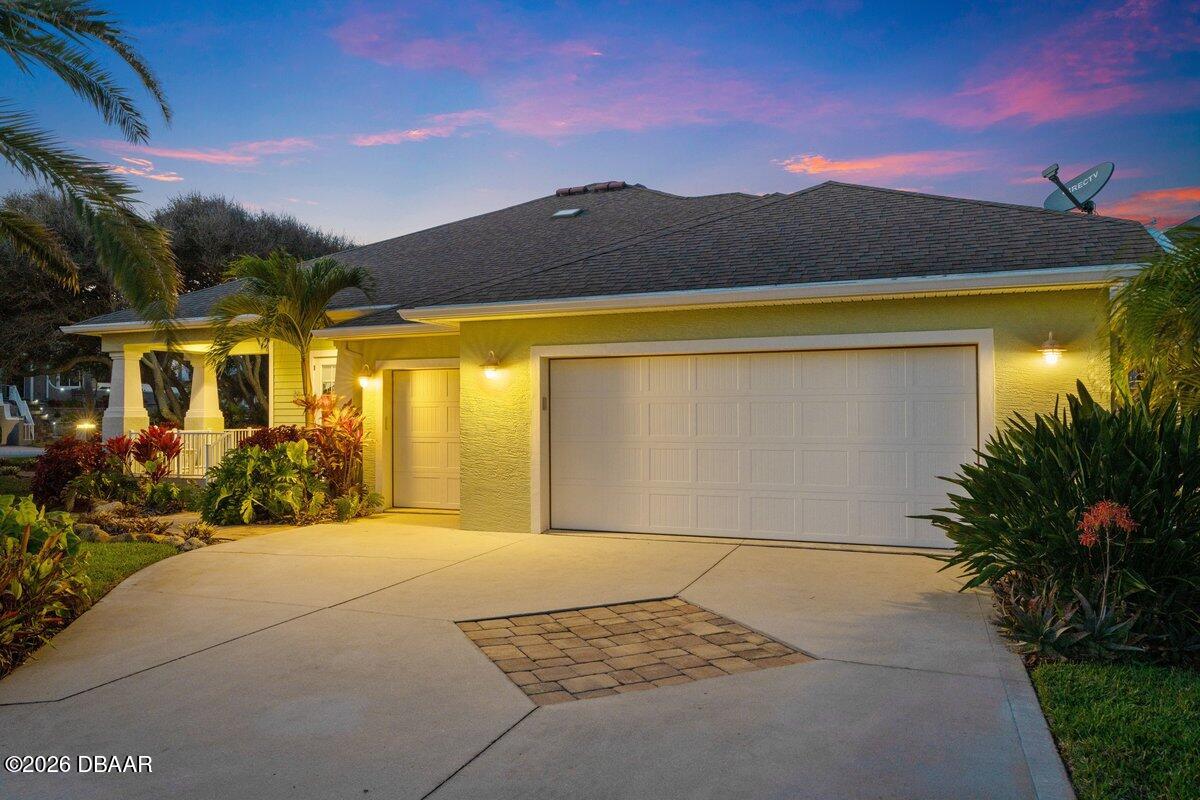 4767 Riverglen Boulevard Ponce Inlet, FL 32127 - Photo 2 of 60 a view of a house with a yard