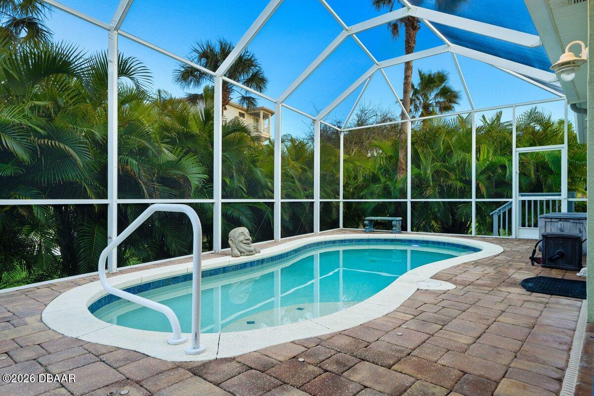 4767 Riverglen Boulevard Ponce Inlet, FL 32127 - Photo 22 of 60 a view of a house with backyard and sitting area