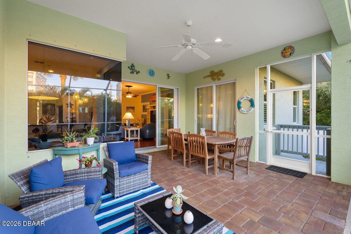 4767 Riverglen Boulevard Ponce Inlet, FL 32127 - Photo 25 of 60 a living room with furniture and a large window