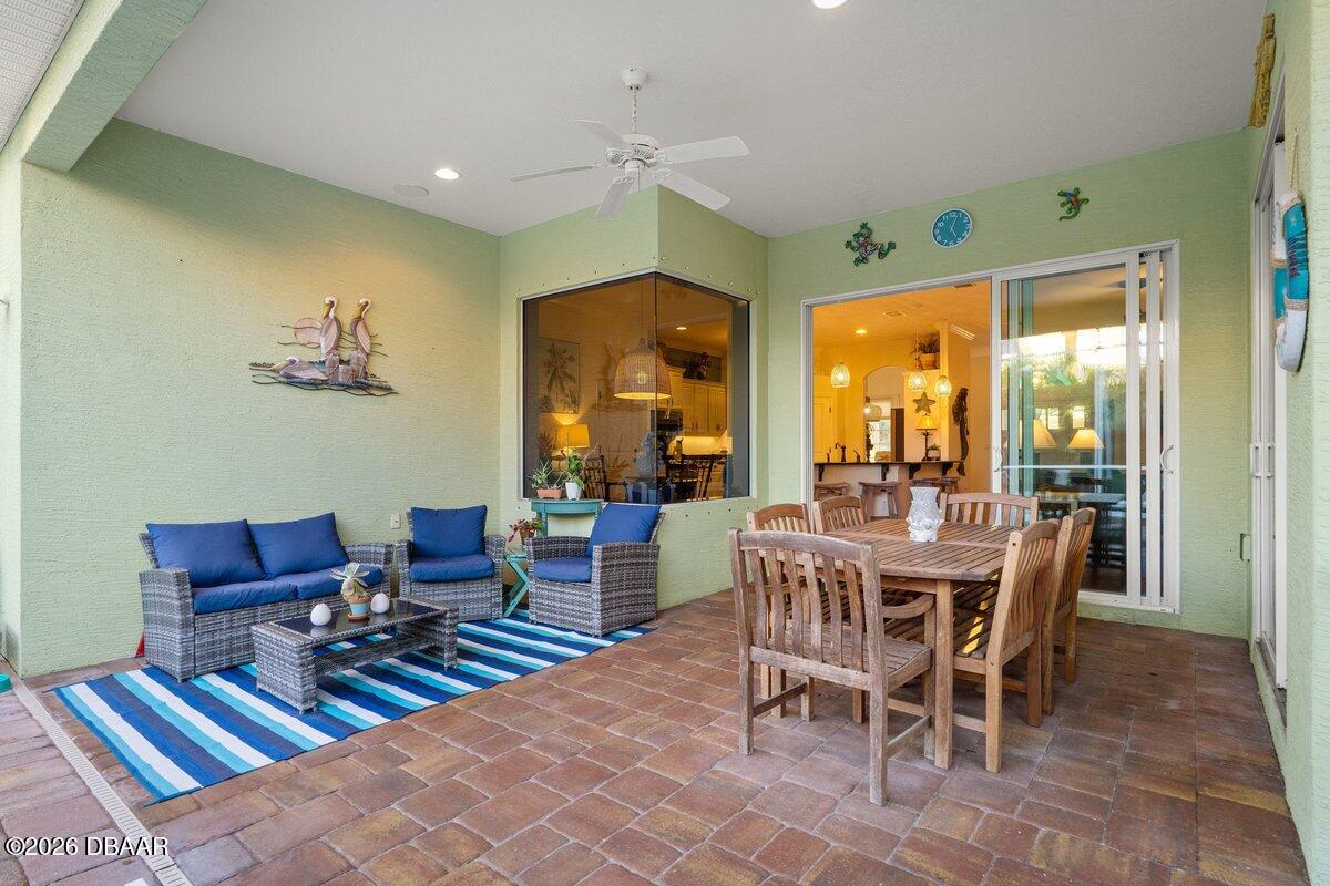 4767 Riverglen Boulevard Ponce Inlet, FL 32127 - Photo 26 of 60 a view of a dining room with furniture window and outside view