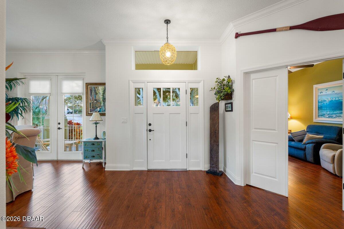 4767 Riverglen Boulevard Ponce Inlet, FL 32127 - Photo 27 of 60 a view of an entryway with wooden floor