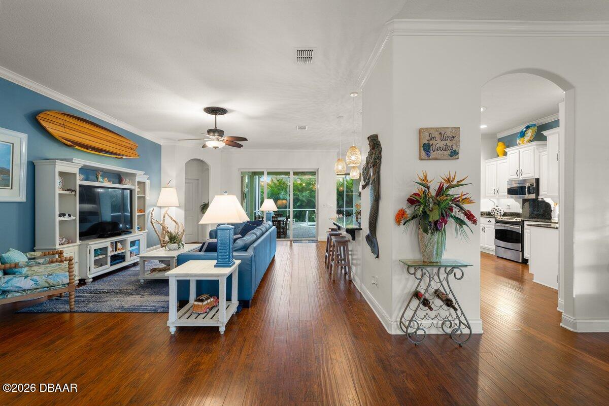 4767 Riverglen Boulevard Ponce Inlet, FL 32127 - Photo 28 of 60 a living room with furniture and a flat screen tv