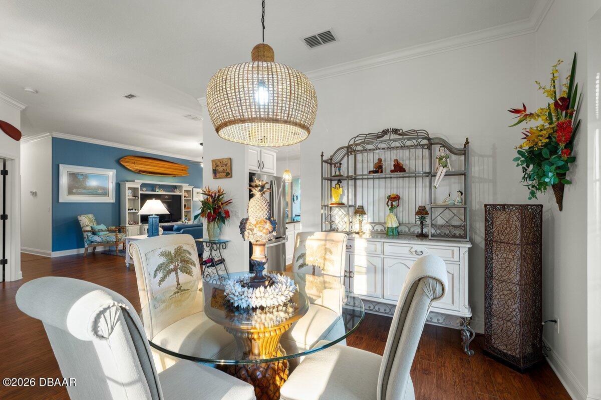 4767 Riverglen Boulevard Ponce Inlet, FL 32127 - Photo 30 of 60 a view of a dining room with furniture a livingroom and chandelier