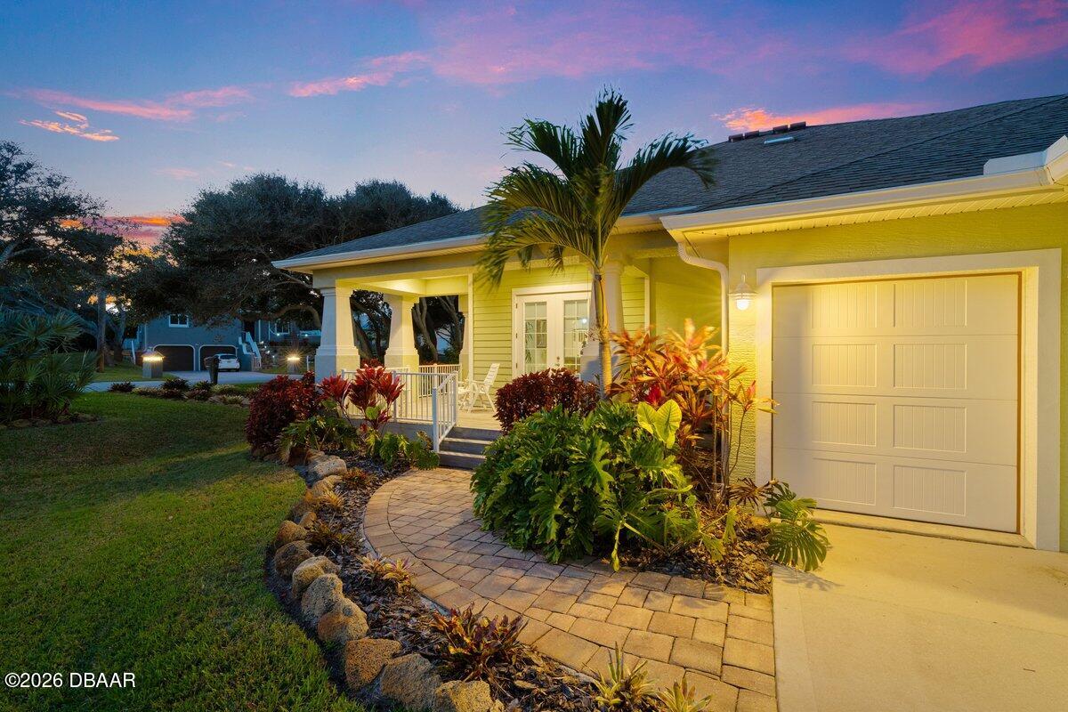4767 Riverglen Boulevard Ponce Inlet, FL 32127 - Photo 3 of 60 a front view of a house with a yard