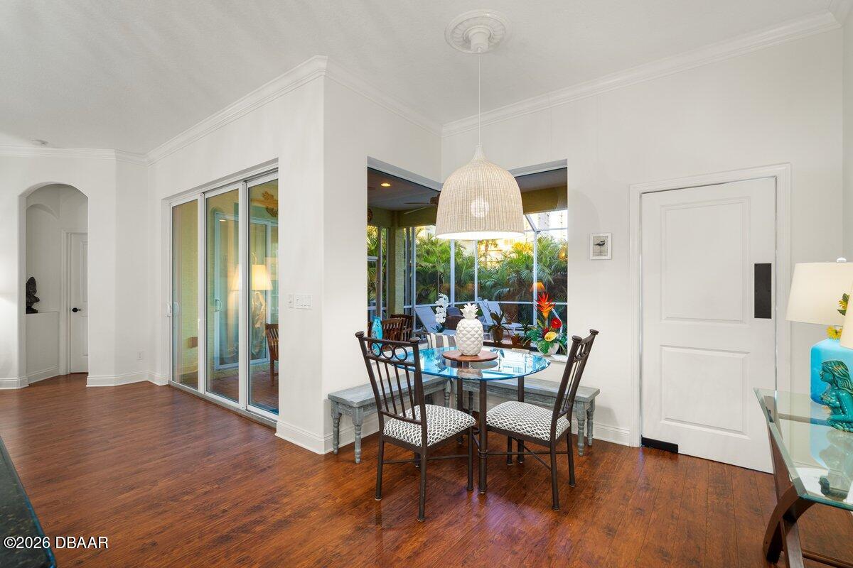 4767 Riverglen Boulevard Ponce Inlet, FL 32127 - Photo 35 of 60 a view of a dining room with furniture window and wooden floor