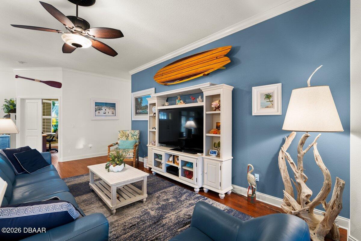 4767 Riverglen Boulevard Ponce Inlet, FL 32127 - Photo 38 of 60 a living room with furniture and a flat screen tv