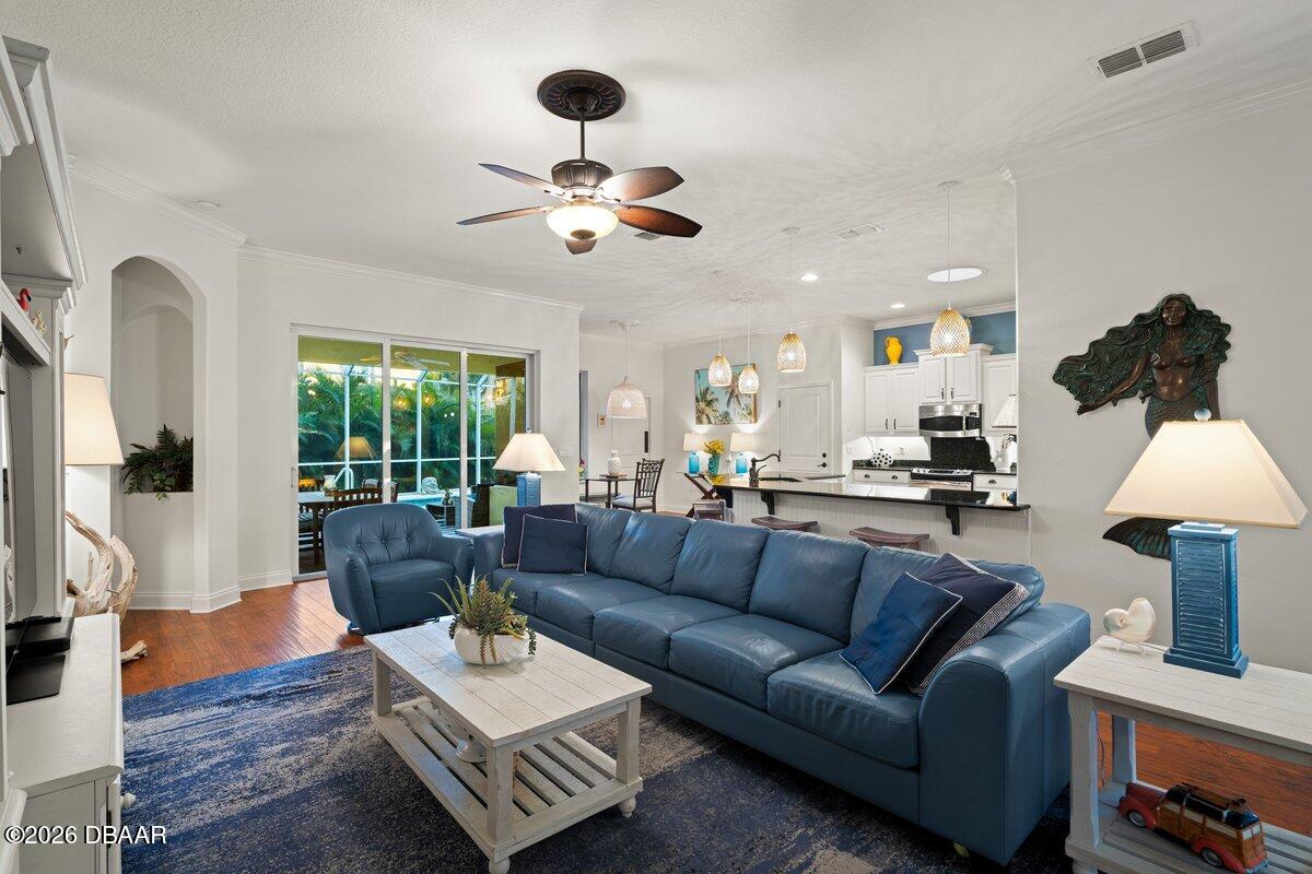 4767 Riverglen Boulevard Ponce Inlet, FL 32127 - Photo 40 of 60 a living room with furniture and wooden floor