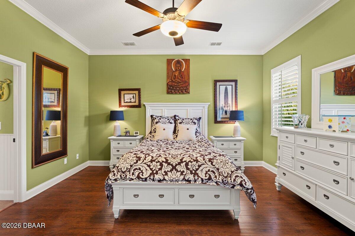 4767 Riverglen Boulevard Ponce Inlet, FL 32127 - Photo 43 of 60 a bedroom with a bed and a dresser