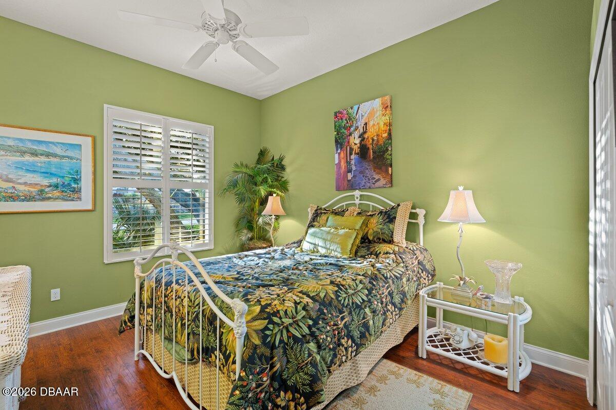 4767 Riverglen Boulevard Ponce Inlet, FL 32127 - Photo 54 of 60 a bedroom with a bed and a window
