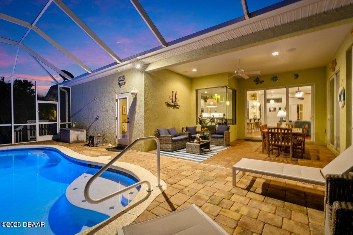 4767 Riverglen Boulevard Ponce Inlet, FL 32127 - Photo 6 of 60 a outdoor space with furniture and white walls