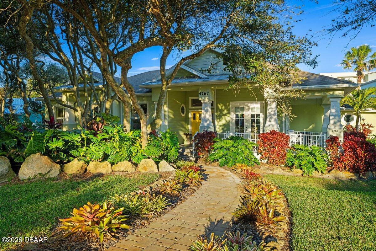 4767 Riverglen Boulevard Ponce Inlet, FL 32127 - Photo 10 of 60 a front view of a house with a yard