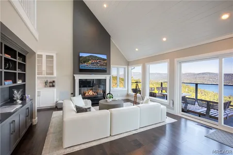 a living room with furniture fireplace and flat screen tv