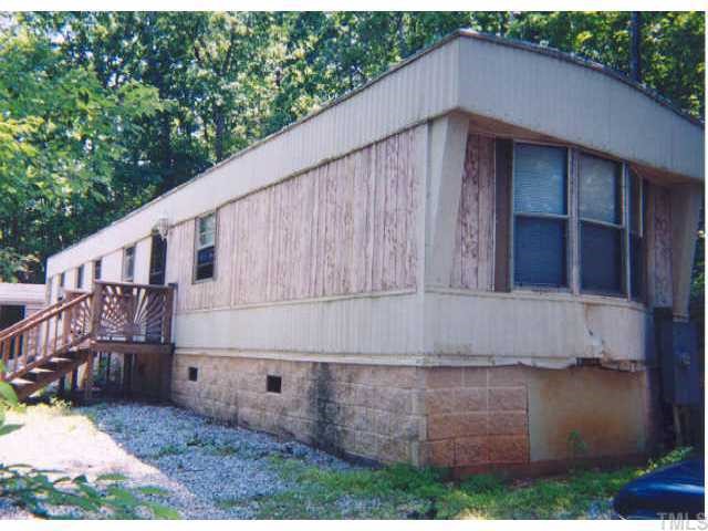 95 Rhododendron Lane Rougemont, NC 27572 - Photo 1 of 1 a backyard of a house