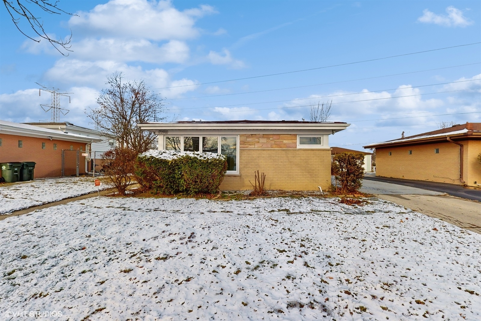 7700 Maple Street Morton Grove, IL 60053 - Photo 1 of 43 a front view of a house with a yard