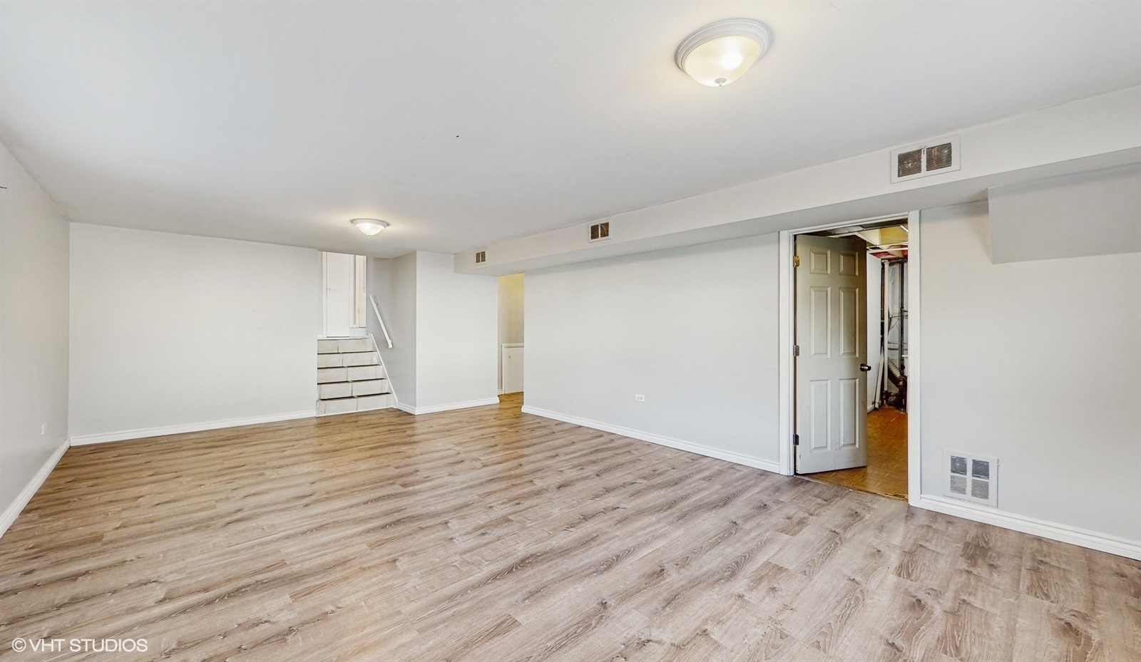 7700 Maple Street Morton Grove, IL 60053 - Photo 14 of 43 a view of an empty room with wooden floor and closet