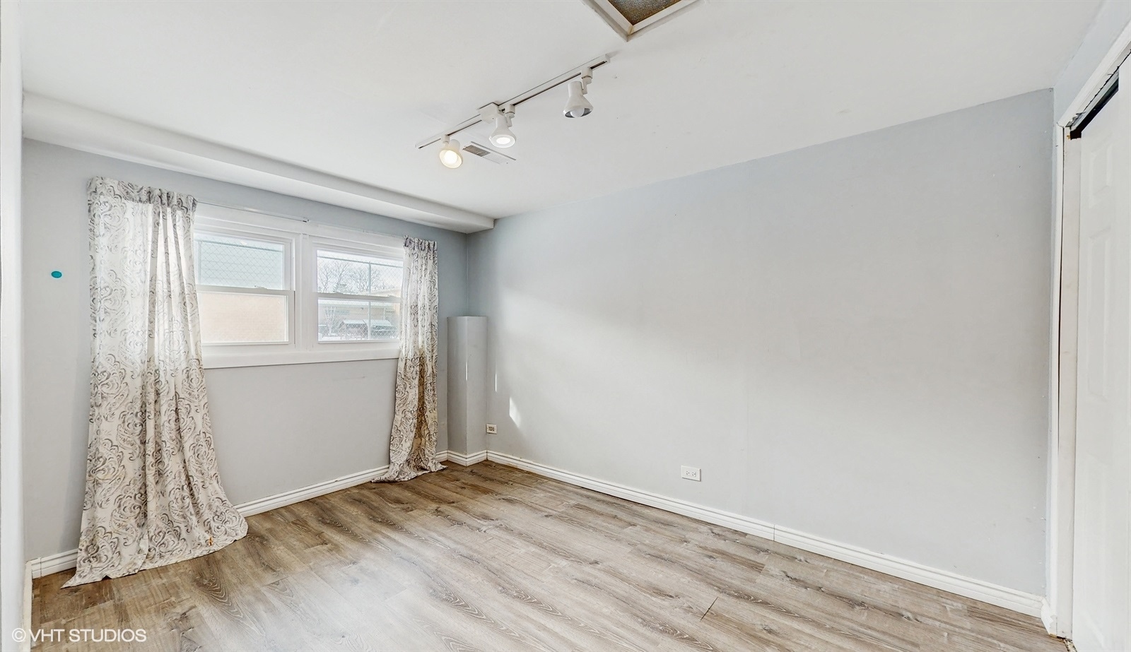 7700 Maple Street Morton Grove, IL 60053 - Photo 16 of 43 an empty room with windows